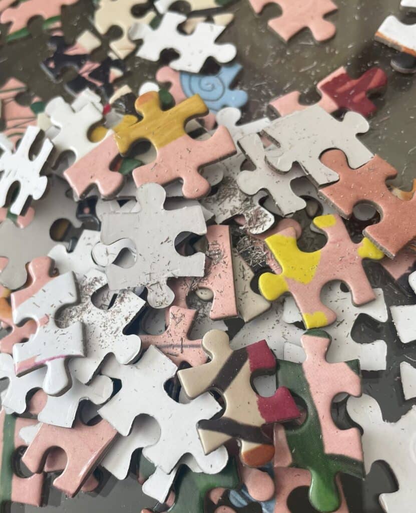 Low-quality gray or white board puzzles tend to shed paper dust.